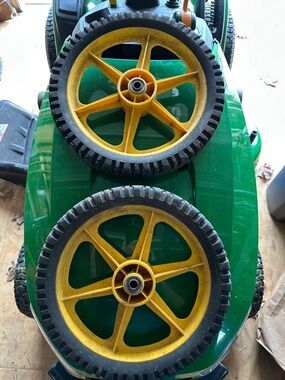 Two lawnmower wheels
